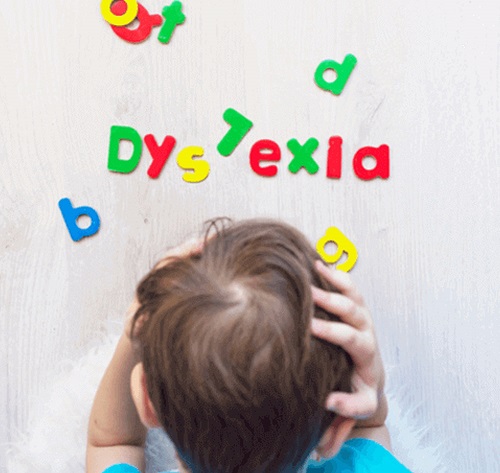 Dyslexic child battling with the alphabet.